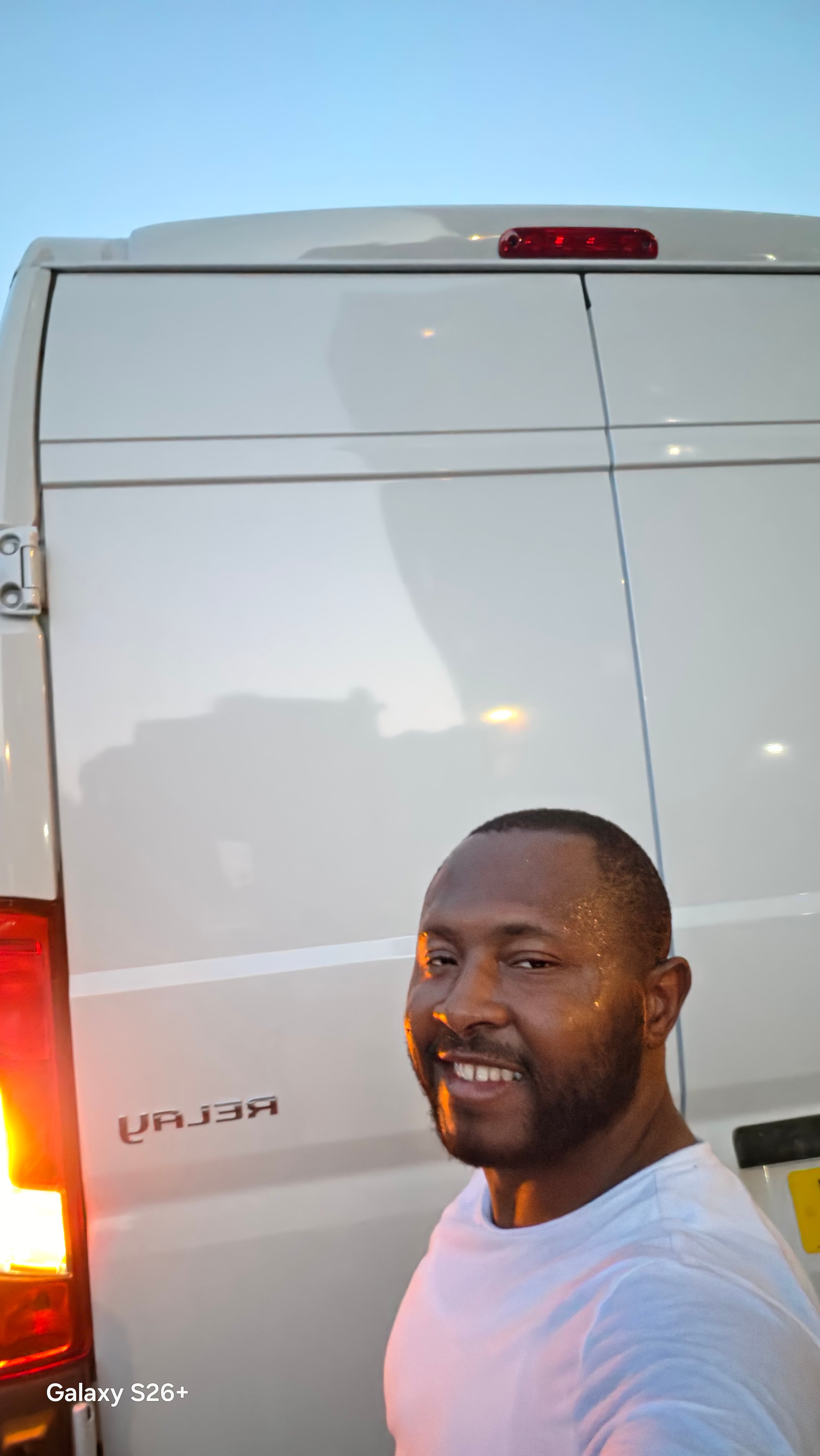 Iconic Corporation Ltd team member with the van