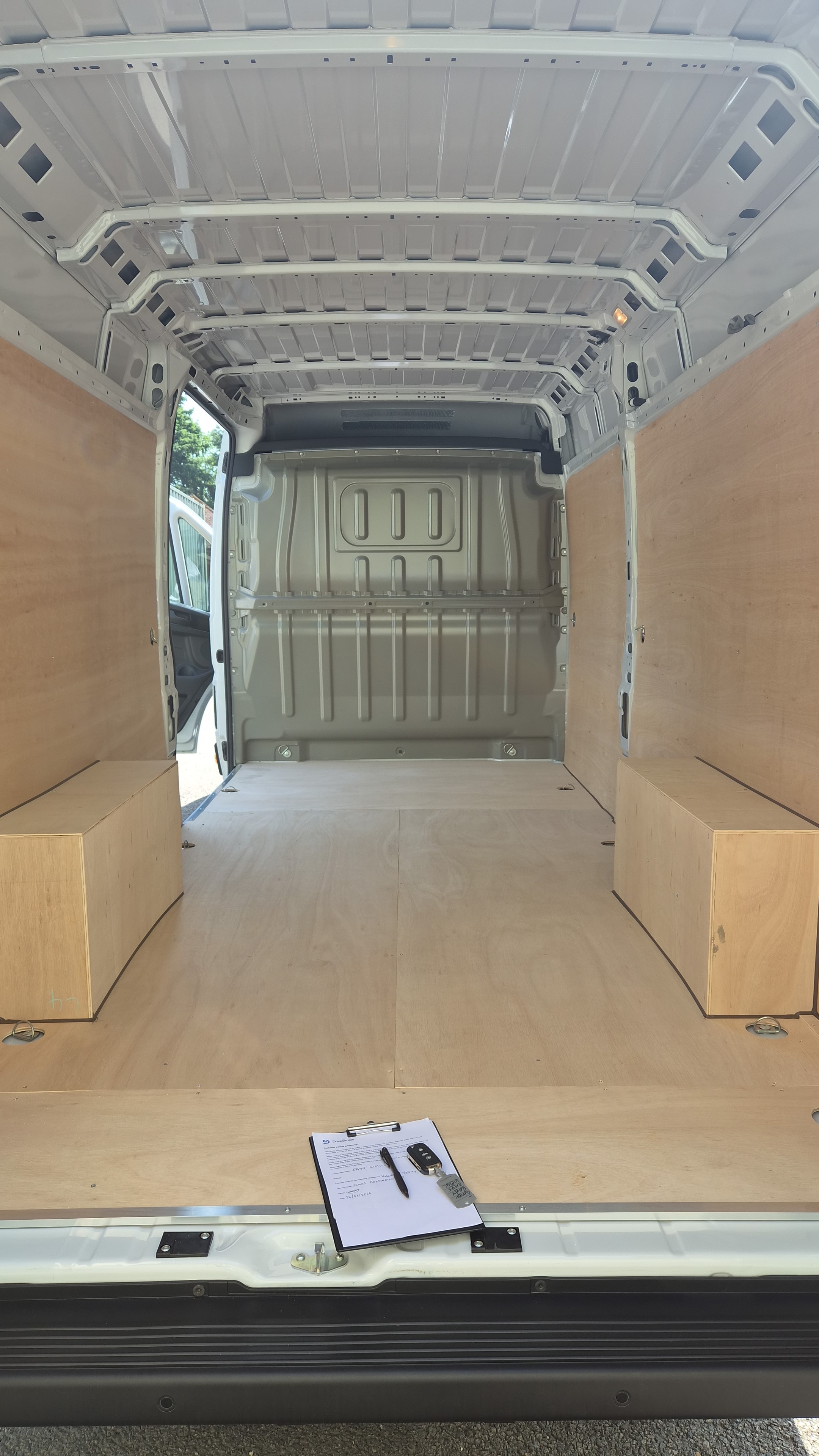 Van interior with ply lining and storage boxes